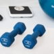 dumbells and scale - benefits of weight loss
